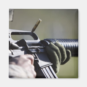 A round flies from the chamber of an M-16A2 Magnet