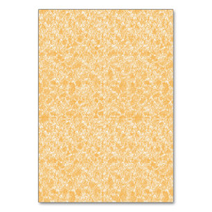 A round rug with a vibrant blend of yellow and ora table number