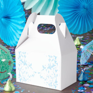 A rug featuring a blue and white creative arts mot favour box
