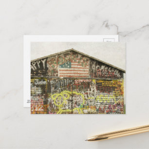 A rural barn covered in graffiti Postcard