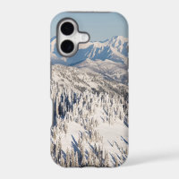 A Scenic View of Snowy Mountains and Trees.