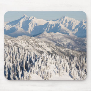 A Scenic View of Snowy Mountains and Trees. Mouse Pad