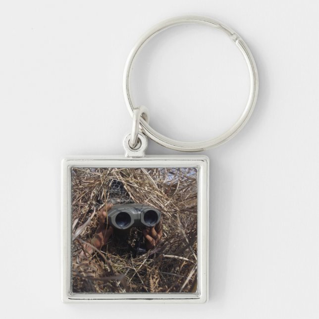 A scout observer practices observation techniqu key ring (Front)