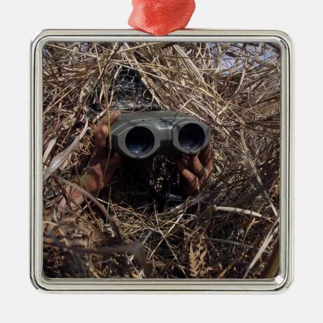 A scout observer practices observation techniqu metal ornament (Front)