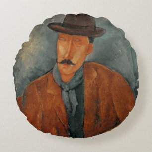A seated man leaning on a table round cushion