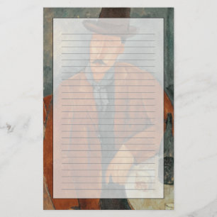 A seated man leaning on a table stationery