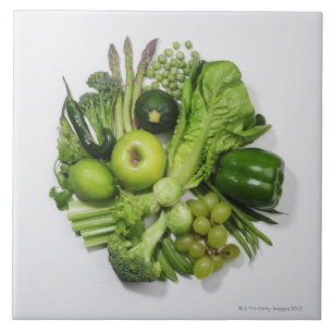 A selection of green fruits & vegetables. ceramic tile