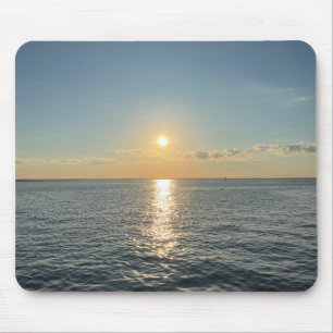 A serene sunset over a calm water horizon mouse pad