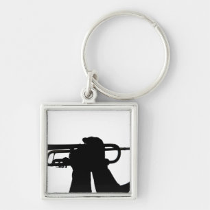 A service member plays a tune key ring