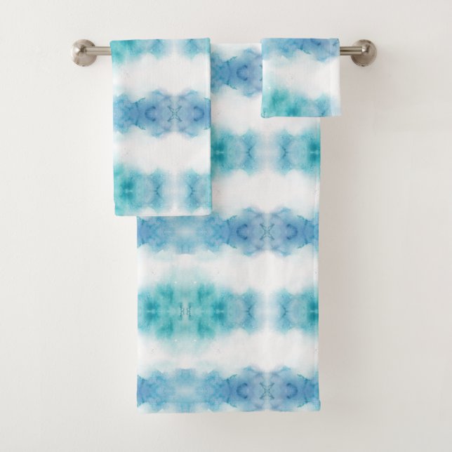 A set of three towels on a rod, featuring a blue  (Insitu)