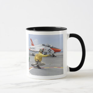 A shooter aboard the aircraft carrier mug
