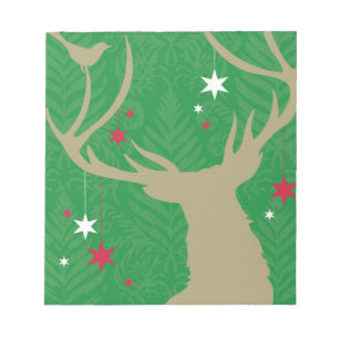 A silhouette of a deer with stars hanging from its notepad