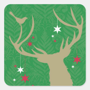 A silhouette of a deer with stars hanging from its square sticker