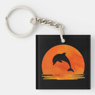 A Silhouette of Jumping Dolphin at Sunset. Key Ring