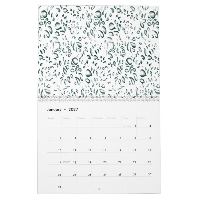 A silver drop splashes into a pool of white liquid calendar (Jan 2027)
