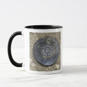 A simulated land mine mug