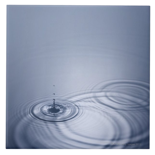 A single droplet of water falling into a calm tile (Front)
