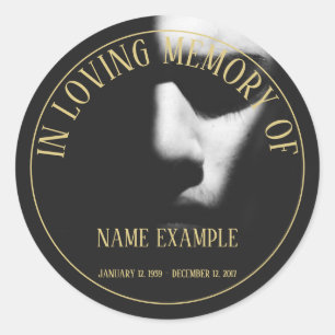A sleeping face in half shadow classic round stick sticker