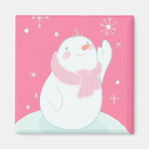 A snowman reaching for a falling snowflake magnet
