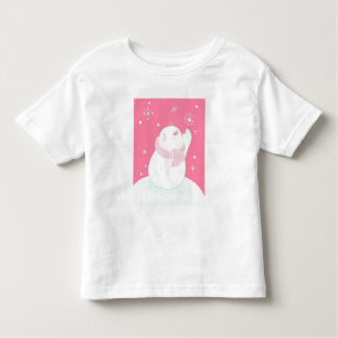 A snowman reaching for a falling snowflake toddler T-Shirt