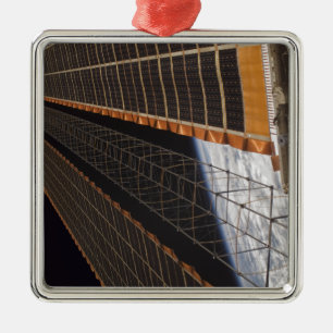 A solar array wing metal ornament