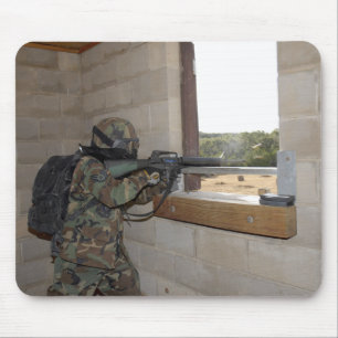 A soldier acts as an opposition force mouse pad