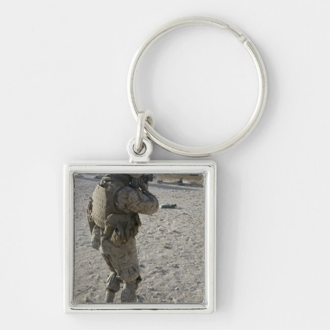 A soldier engages his target on a shooting rang key ring (Front)