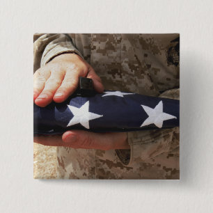 A soldier holds the United States flag 15 Cm Square Badge