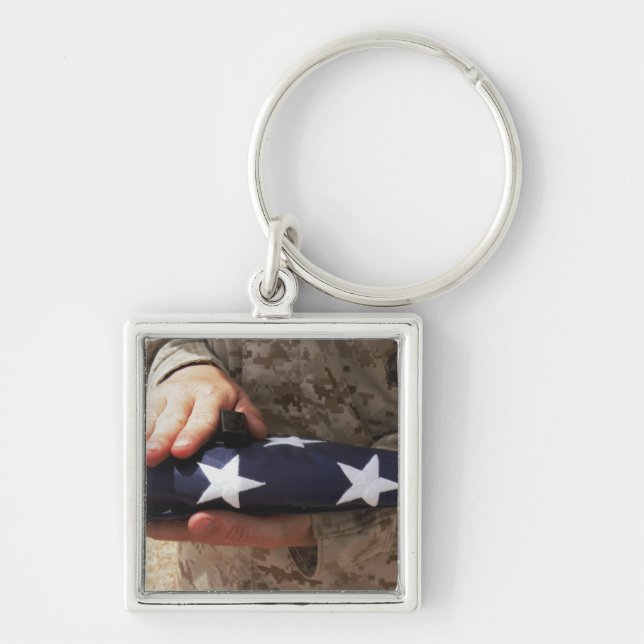 A soldier holds the United States flag Key Ring (Front)