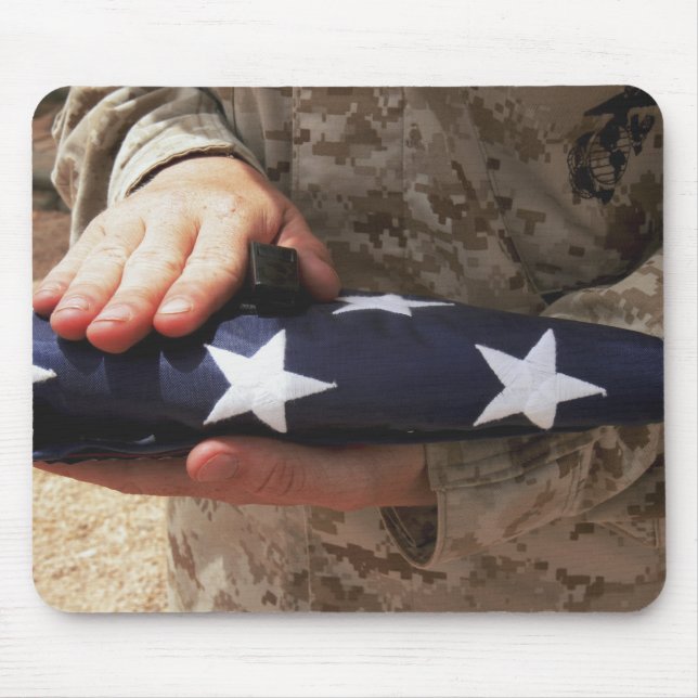 A soldier holds the United States flag Mouse Pad (Front)