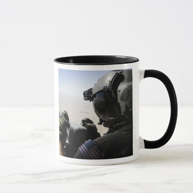 A soldier provides security mug (Right)