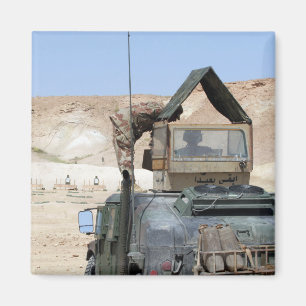 A soldiier instructs an Iraqi army soldier Magnet