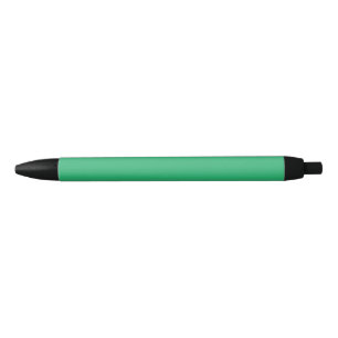 A solid green square positioned on a white backdro black ink pen