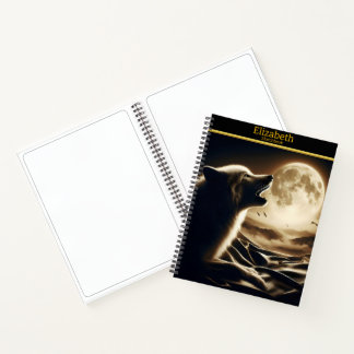 A solitary wolf's call beneath a radiant moon notebook