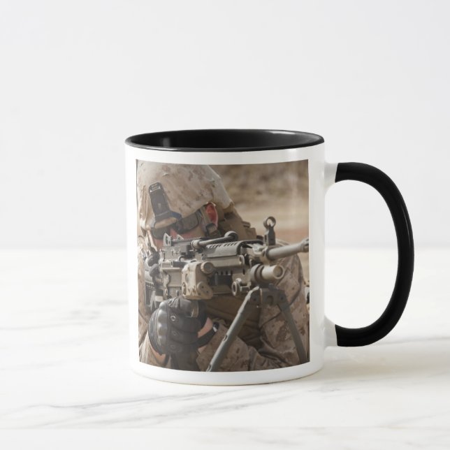 A squad automatic weapon gunner provides securi mug (Right)