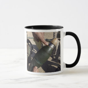 A squad leader points to a delay setting mug
