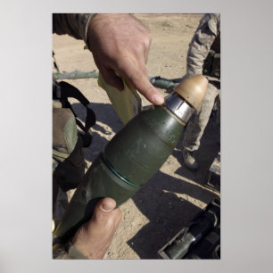 A squad leader points to a delay setting poster