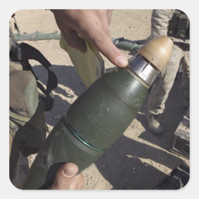 A squad leader points to a delay setting square sticker (Front)
