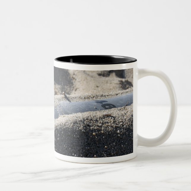 A static display of an ordnance shell Two-Tone coffee mug (Right)