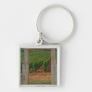 A stone portico to the vineyard key ring