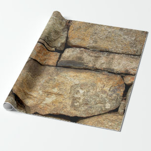 A stone wall made of cobblestones background textu wrapping paper