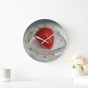 A strawberry in a cup large clock