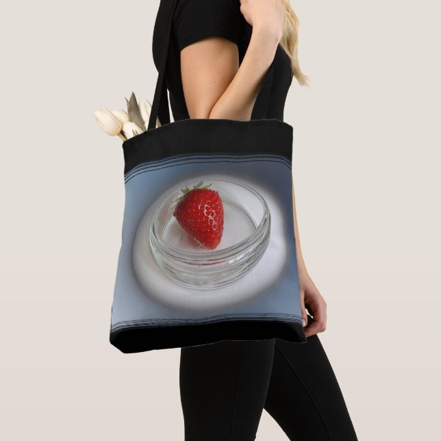 A strawberry in a cup tote bag (Close Up)