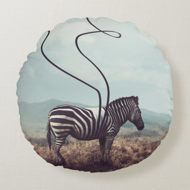 A surreal image of a zebra and two of its black st round cushion (Front)