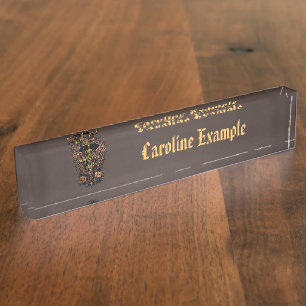 A symbol of strength: The ornate cross with wings. Nameplate