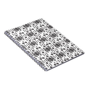 A symmetrical monochrome design featuring intricat notebook