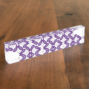 A symmetrical pattern featuring white and purple m nameplate