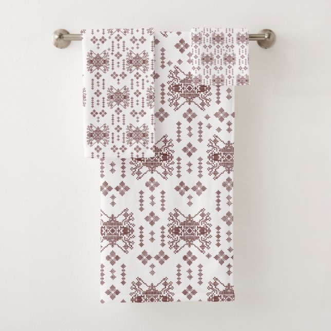 A symmetrical white wrapping paper featuring a rep bath towel set (Insitu)