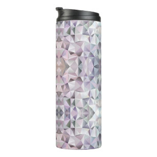 A tall travel mug with a black lid