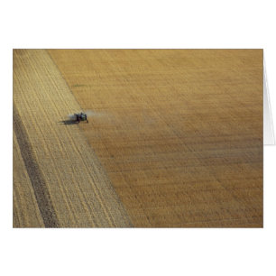 A tractor harvesting